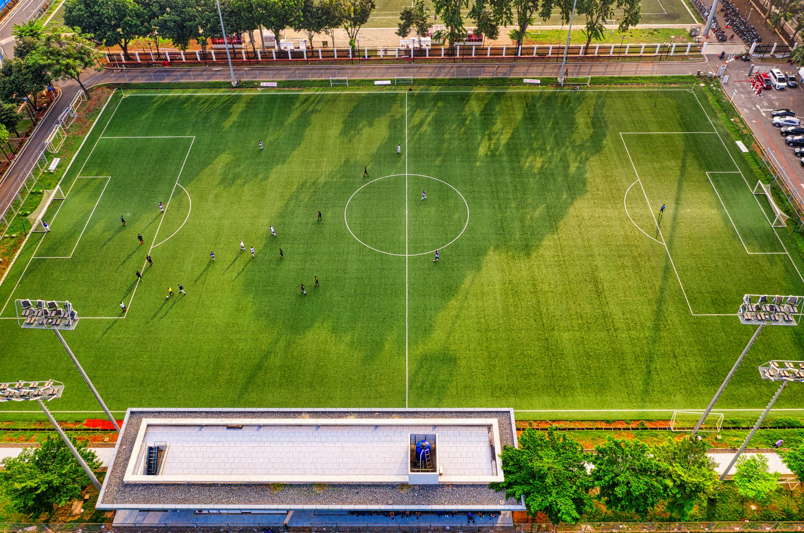 High-angle shot of a soccer game at a stadium in Jakarta, Indonesia.